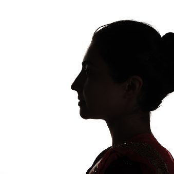 Indian young adult woman profile view silhouette portrait.
